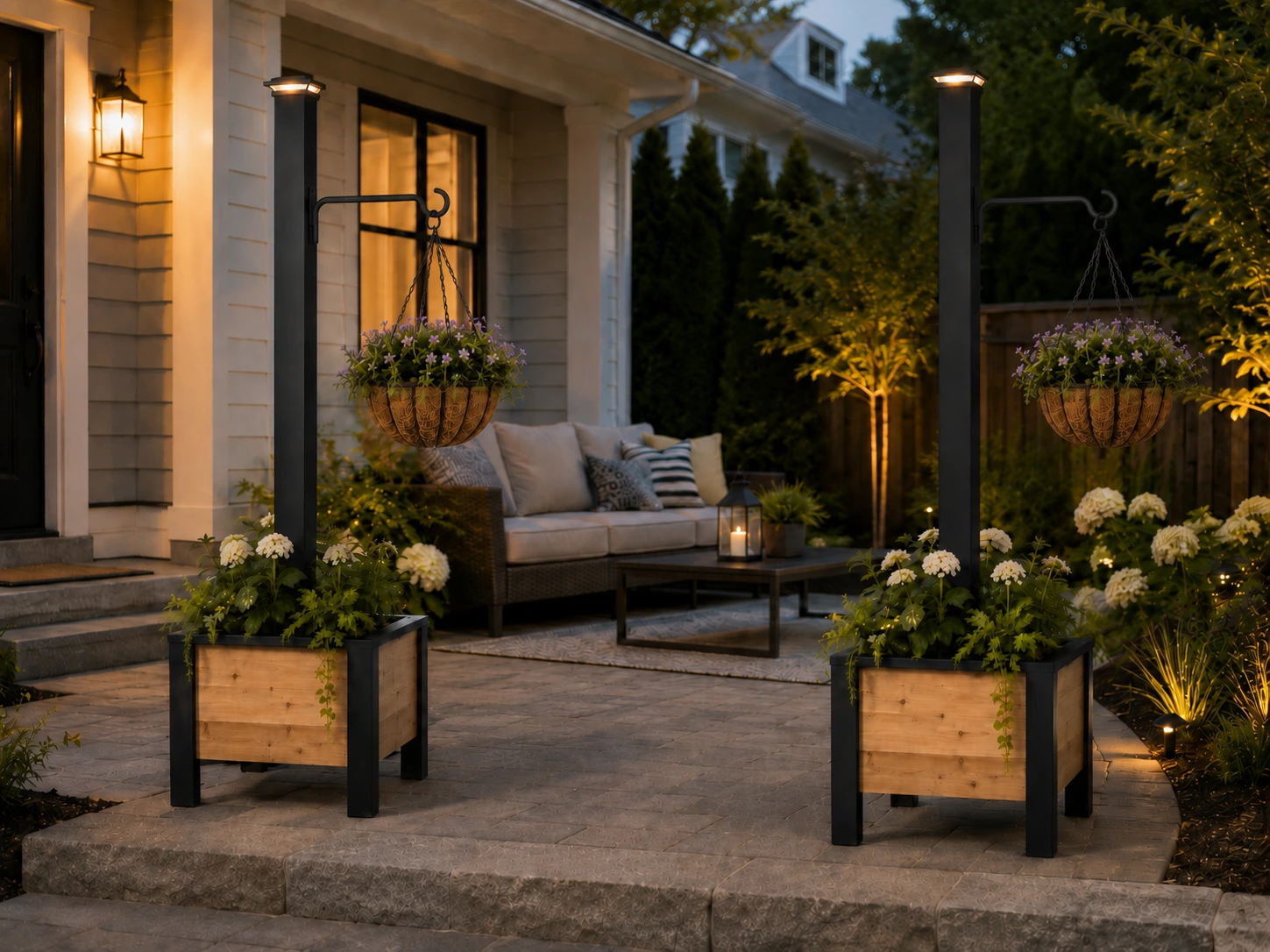 Two cedar planter boxes with posts staged on a patio with hanging flower baskets using the recommended 12-inch black metal hanger and solar LED post-cap lights